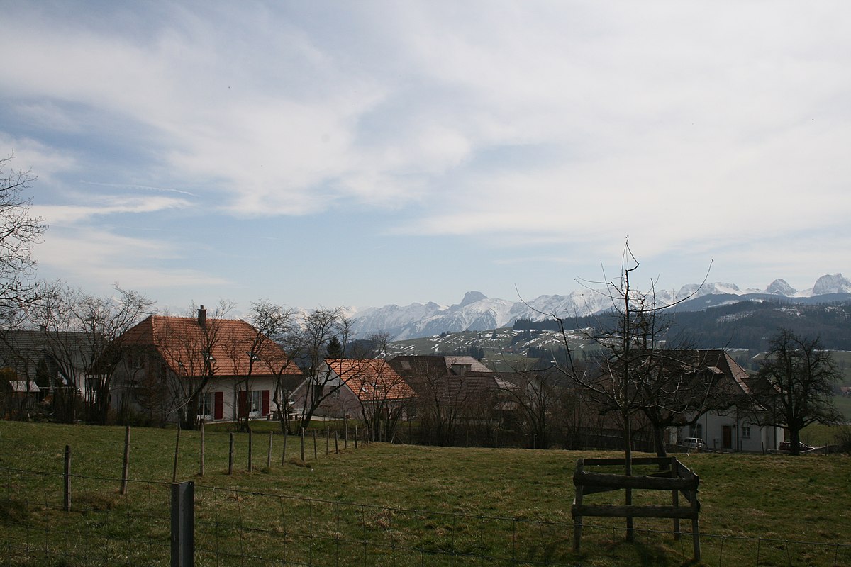 Rueggisberg village with Alps in the background